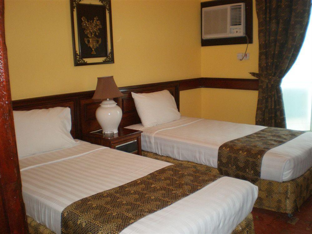 Concord International Hotel Manama Zimmer foto